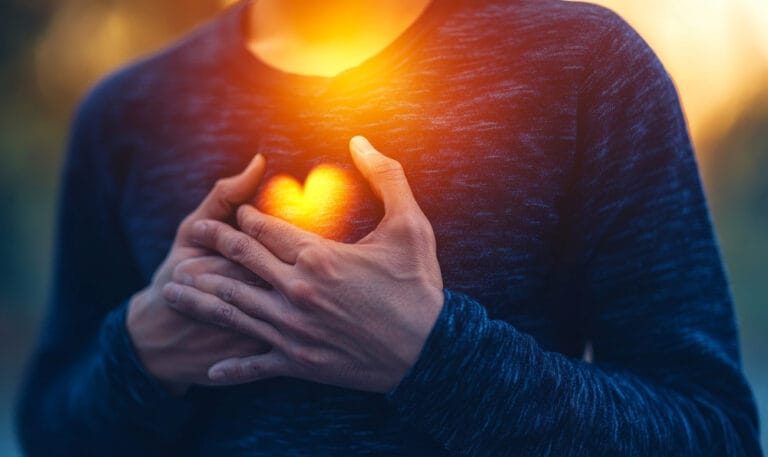 an individual clutching their chest in pain, illustrating a hear